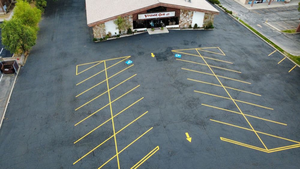 Aerial view of Vintage Oak store with empty parking lot and marked spaces.